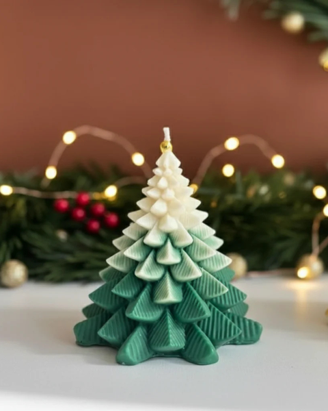 Christmas tree-shaped candle with gradient colors on a decorative background
